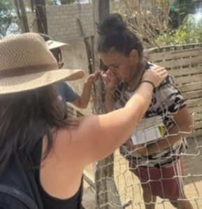 praying with woman in mexico 